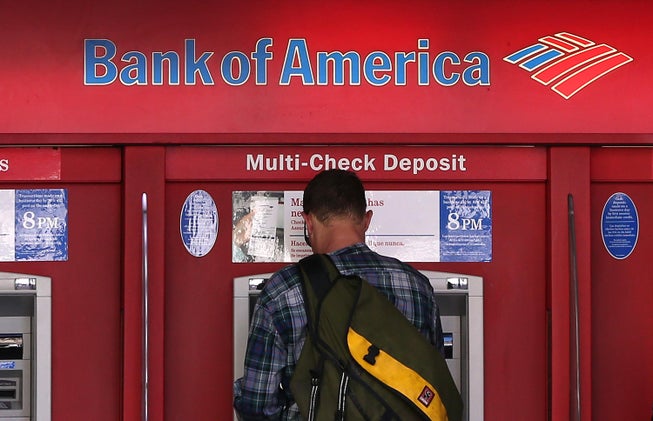 A man uses an ATM in San Francisco.